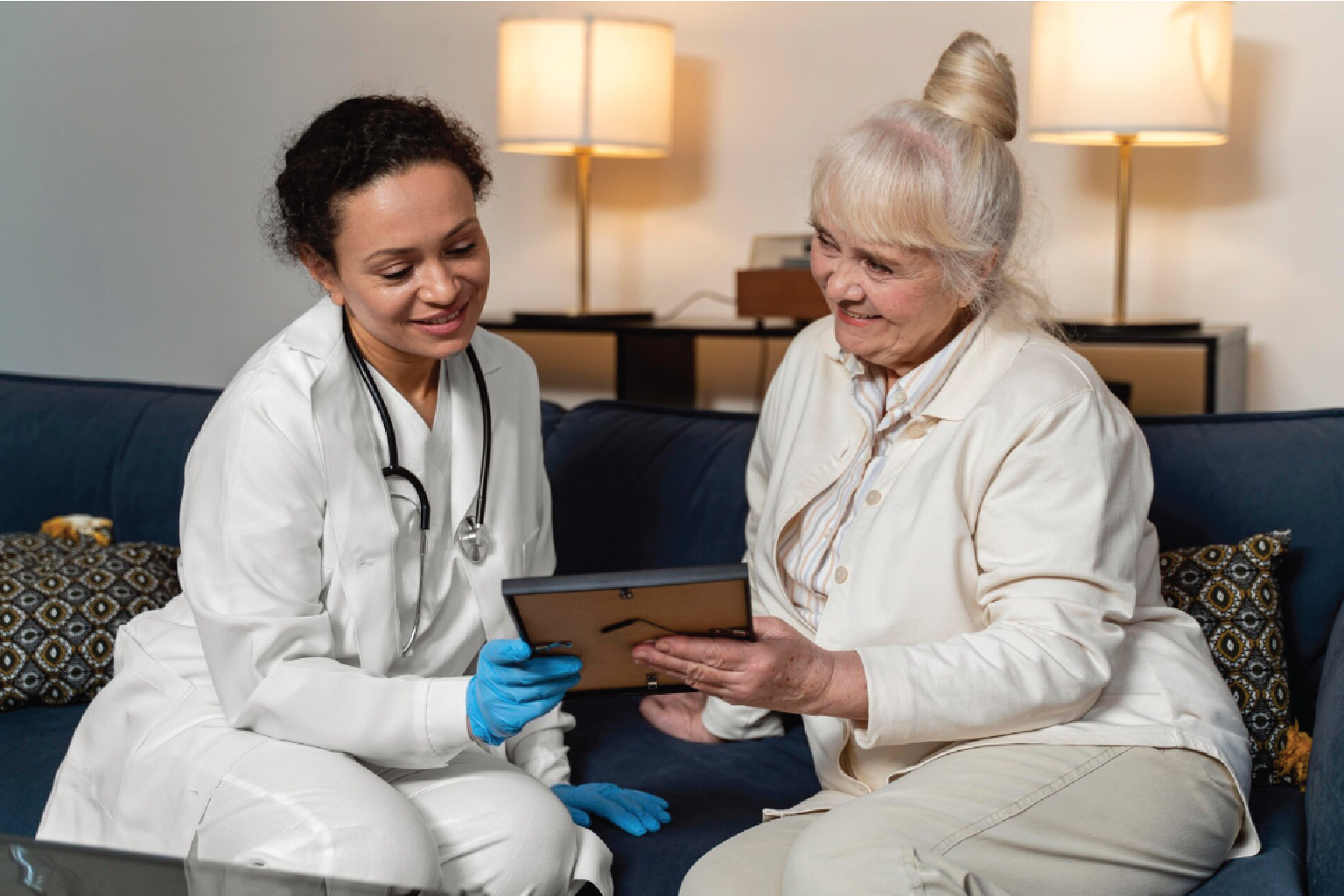 Caregiver sharing a conversation with a senior client at home