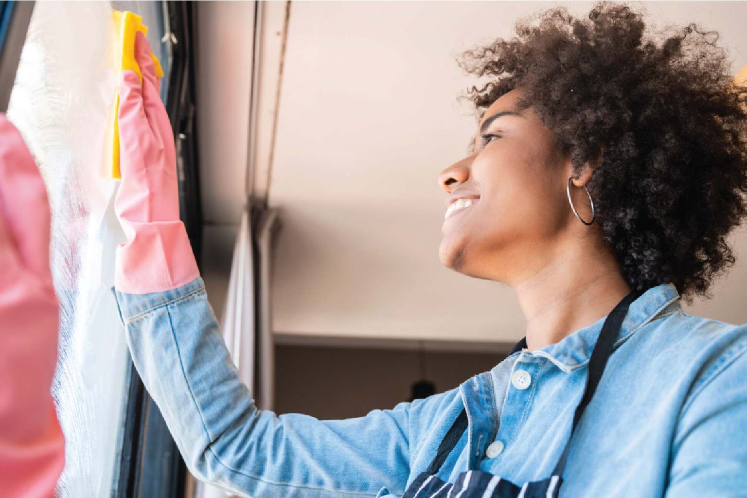 Caregiver quickly tidying a living room